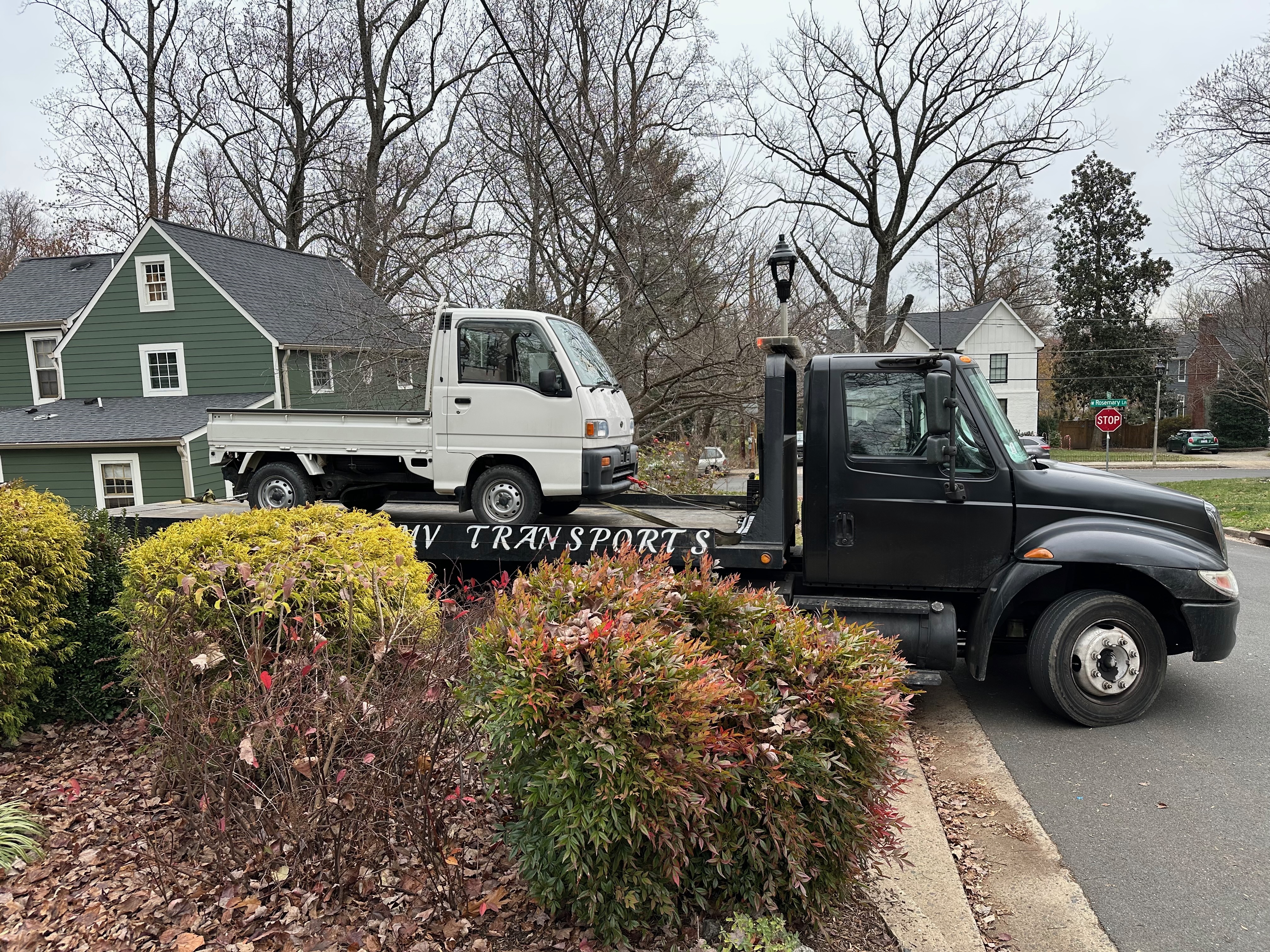 Truck on top of flatbed tow truck